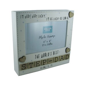 May include: White wooden photo frame with a 15x10cm opening. The frame has a white background with grey polka dots and the text "I'm very, very lucky, I'm as lucky as can be." The frame also has the text "The world's best step-dad" with wooden letter tiles and two small wooden hearts.
