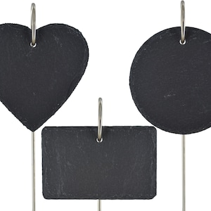 May include: Three black slate signs with silver metal rings and stands. The signs are shaped like a heart, a circle, and a rectangle.