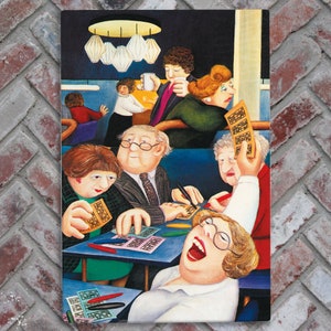 May include: A group of people are gathered around a table playing bingo. They are all smiling and laughing. There are bingo cards, chips, and a bingo cage on the table. The people are wearing casual clothing and are having a good time.
