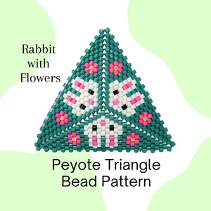 May include: A green triangle peyote stitch bead pattern featuring three white rabbits with pink ears and black eyes, surrounded by pink flowers with yellow centres.
