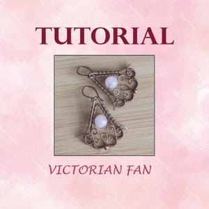 May include: A pair of copper wire earrings with a Victorian fan design and a white stone in the centre. The earrings are on a wooden surface. TUTORIAL VICTORIAN FAN