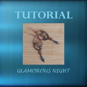 May include: A pair of copper wire earrings with a heart-shaped design and dark blue glass beads. The earrings are on a wooden surface. The text "GLAMOROUS NIGHT" is below the earrings.