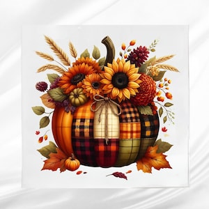 May include: A decorative pumpkin with a patchwork design in orange, red, and green plaid. The pumpkin is adorned with sunflowers, wheat stalks, and fall foliage. A small pumpkin and leaves are at the base.