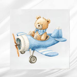May include: A watercolor illustration of a teddy bear wearing a blue scarf, seated in a light blue airplane. The plane has white stripes on the wings and a brown propeller. The image has a soft, whimsical feel.