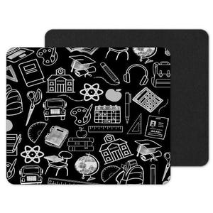 May include: Black mousepad with a white school-themed pattern. The design includes school buses, books, globes, calculators, and graduation caps. The mousepad has a rectangular shape with rounded corners.