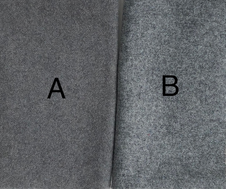 May include: Two samples of gray fabric, labeled A and B. The fabric has a textured, flecked appearance.
