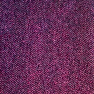 May include: A close-up of a dark purple fabric with a herringbone pattern.
