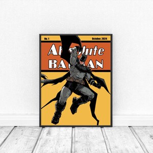 May include: A framed comic book cover featuring Batman in a dynamic pose. The artwork is set against an orange and yellow background, with the title "Absolute Batman" in bold white letters. The cover is dated October 2024.