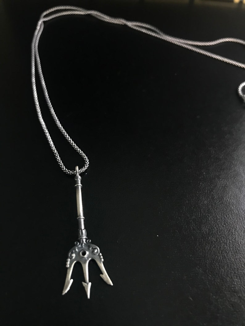 Posedion spear silver necklace.