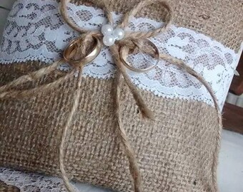 A beautiful hand made Hessian and white lace ring pillow.
