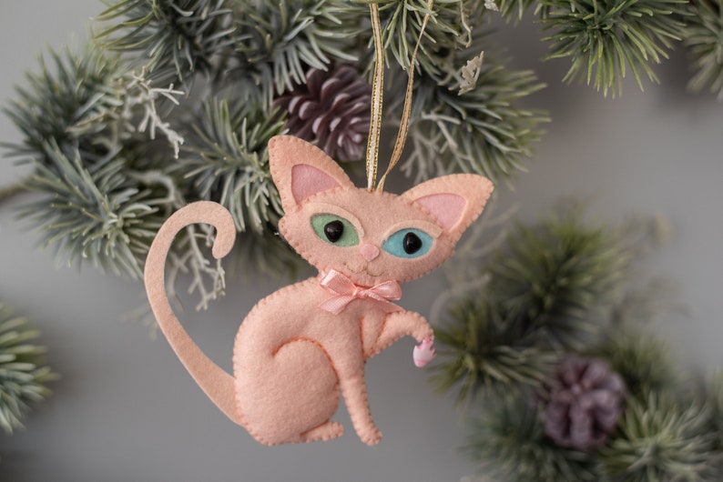 Christmas sphynx cat ornament made from felt. Handsewn.