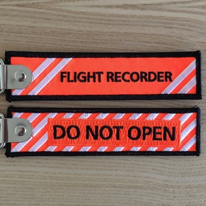Porte-clé "Flight Recorder - Do Not Open"