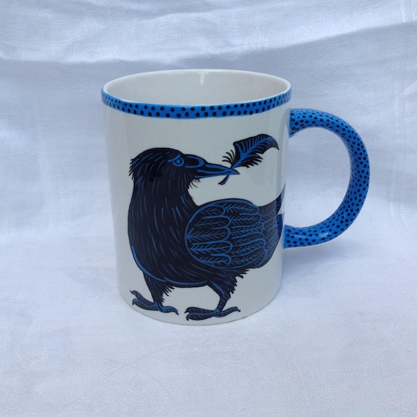 Handpainted porcelain mug with Raven and feather.