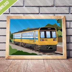May include: A framed digital download print featuring a yellow and blue train on a track, set against a blue sky and green trees. The print is in a wooden frame and leans against a brick wall. The words "DIGITAL DOWNLOAD" are in a green banner.