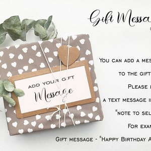 May include: A wrapped gift with a brown and white heart-patterned paper, tied with twine and a small, brown heart-shaped tag. A rectangular tag reads "ADD YOUR GIFT MESSAGE". Text on the right explains how to add a gift message.