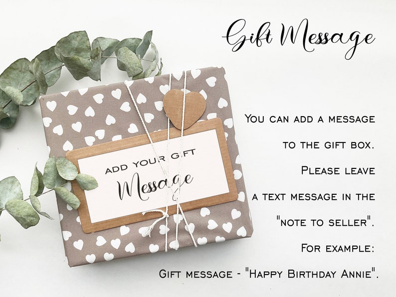 May include: A wrapped gift with a brown and white heart-patterned paper, tied with twine and a small, brown heart-shaped tag. A rectangular tag reads "ADD YOUR GIFT MESSAGE". Text on the right explains how to add a gift message.