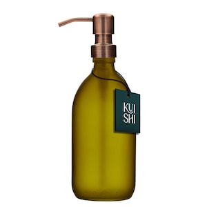 May include: A copper pump bottle with a green glass body and a black tag that says "KUI SHI".