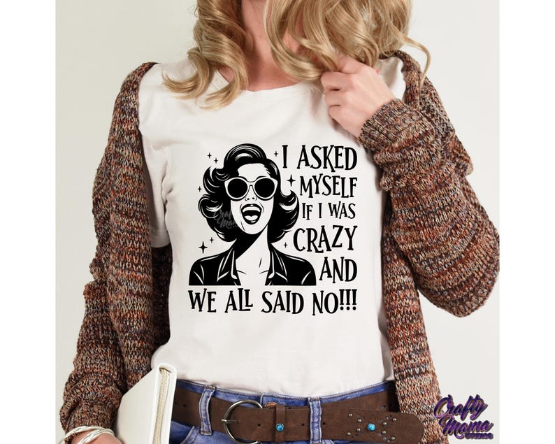 May include: A white t-shirt with a black and white illustration of a woman with sunglasses and the text "I asked myself if I was crazy and we all said no!!!"