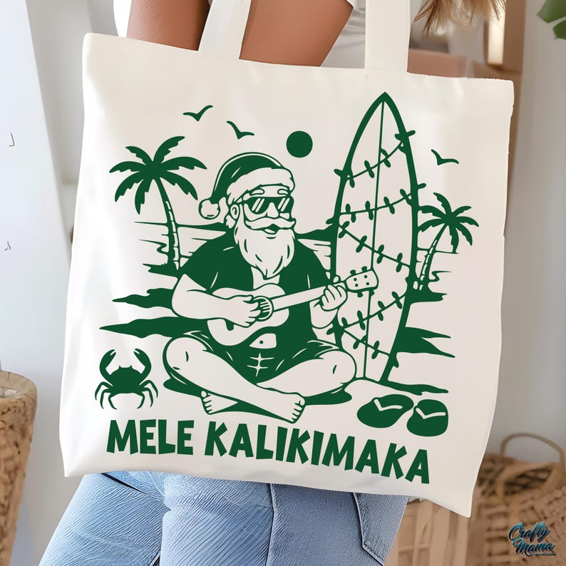 May include: Off-white tote bag with a green graphic of Santa Claus playing a ukulele on a beach, with a surfboard, palm trees, and the text "MELE KALIKIMAKA". The design is a festive holiday theme.