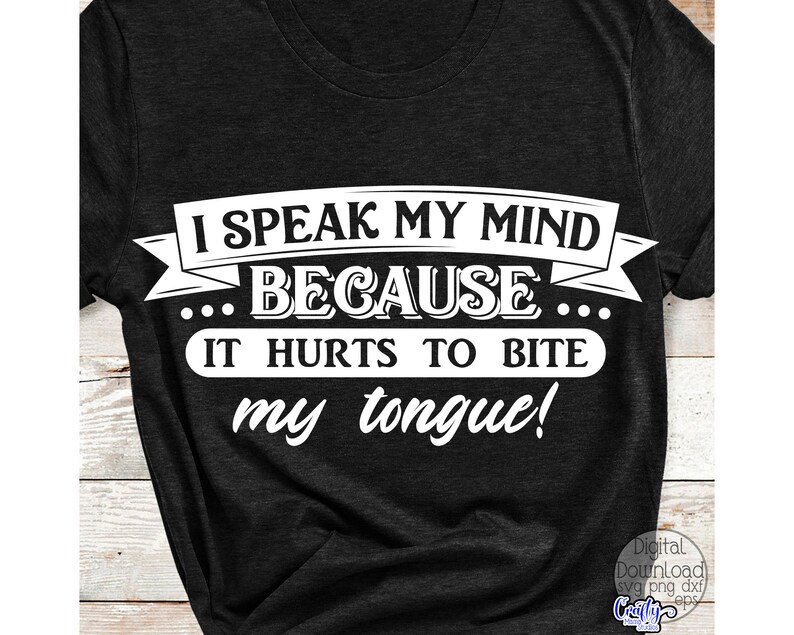 May include: Dark gray t-shirt with the white text: "I SPEAK MY MIND BECAUSE IT HURTS TO BITE my tongue!" The text is in a bold, easy-to-read font. The shirt is a casual style.