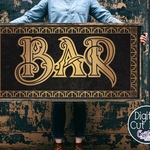 May include: A gold-colored "BAR" sign with a decorative, ornate font. The sign is framed with a gold-colored border and has a dark background.