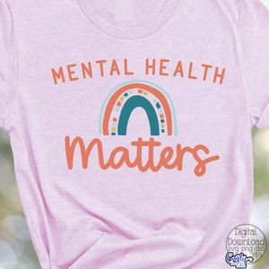 May include: Pink t-shirt with the text "Mental Health Matters" in orange and white. A rainbow with blue, green, orange, and yellow colors is above the text.