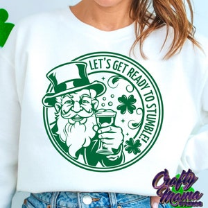 May include: White sweatshirt with a green graphic of a leprechaun holding a beer mug. The graphic says "Let's get ready to stumble!"