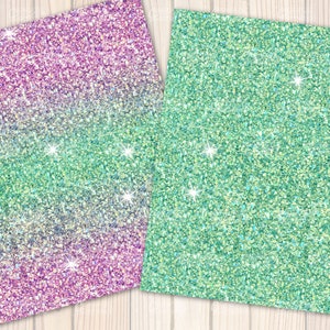 May include: Two sheets of glitter paper. One sheet has a gradient of purple to green, and the other is solid green. Both sheets have sparkling highlights and are set against a light wood grain background.