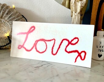 Love with a Kiss! Printed from an Original Hand Felted Textile Design.