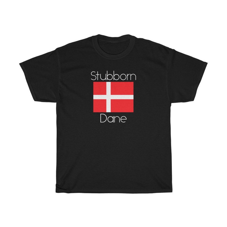 May include: Black t-shirt with white text that reads "Stubborn Dane" and a red and white Danish flag.
