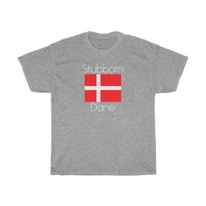 May include: A gray t-shirt with the text "Stubborn Dane" and a red and white Danish flag.