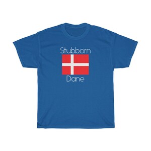 May include: A royal blue t-shirt with the text "Stubborn Dane" and a red and white Danish flag.
