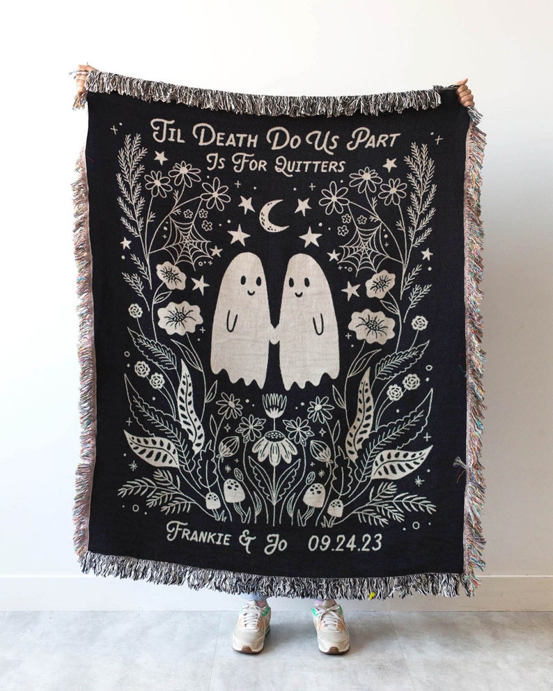 May include: Black woven throw blanket with a white design of two ghosts holding hands, surrounded by flowers and stars. The text "Til Death Do Us Part Is For Quitters" is at the top, and "Frankie & Jo 09.24.23" is at the bottom.