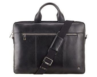 Può includere: Borsa per laptop in pelle nera con tracolla e tasca con zip sul davanti.