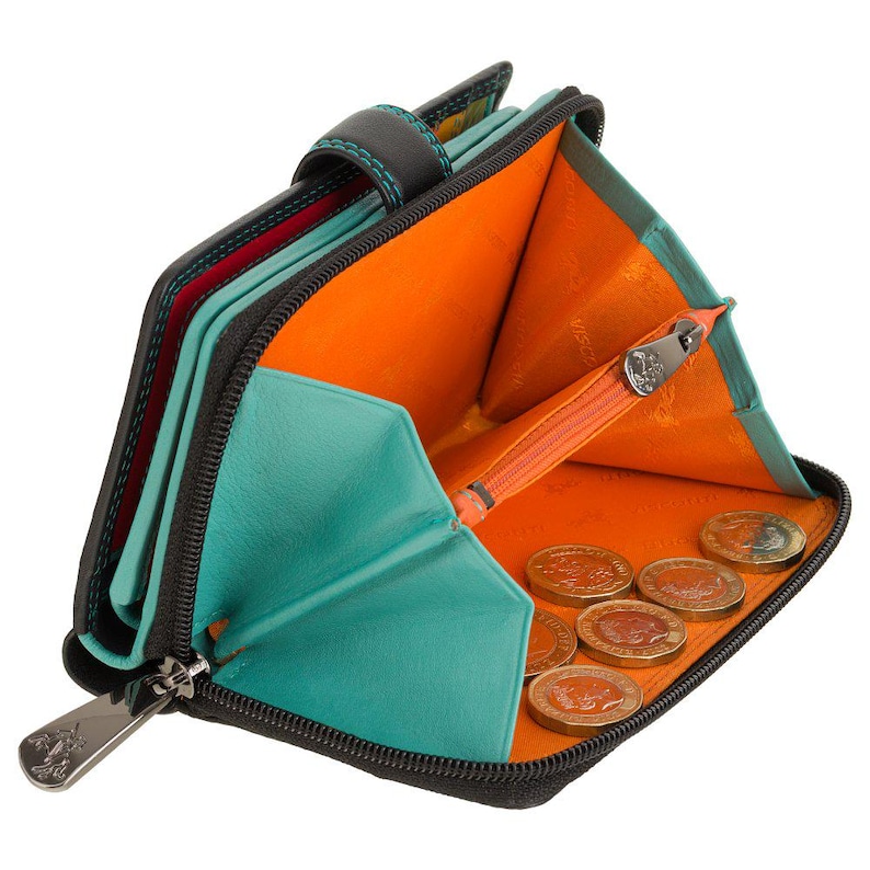 May include: A black leather wallet with a vibrant orange interior and turquoise accents. The wallet is partially open, revealing a central zippered coin compartment containing several gold-coloured coins. A silver metal zip pull is visible.