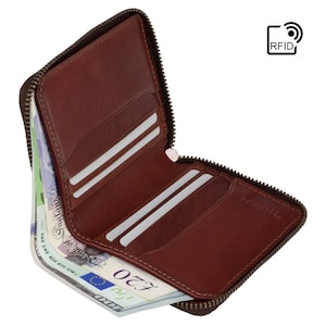 May include: A brown leather zippered wallet with multiple card slots and a bill compartment. The wallet is open and has British pound notes inside. The wallet has RFID blocking technology.