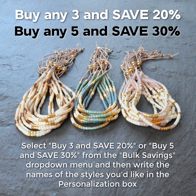 May include: Three stacks of beaded bracelets in white, blue, and pink. The bracelets are made with small, round beads and gold accents. The text "Buy any 3 and SAVE 20% Buy any 5 and SAVE 30%" is at the top of the image. The text "Select "Buy 3 and SAVE 20%" or "Buy 5 and SAVE 30%" from the "Bulk Savings" dropdown menu and then write the names of the styles you'd like in the Personalization box" is at the bottom of the image.