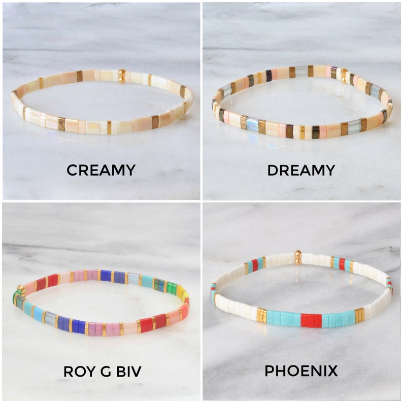 May include: Four different colorful beaded bracelets with gold accents. The bracelets are named "Creamy", "Dreamy", "Roy G Biv", and "Phoenix".