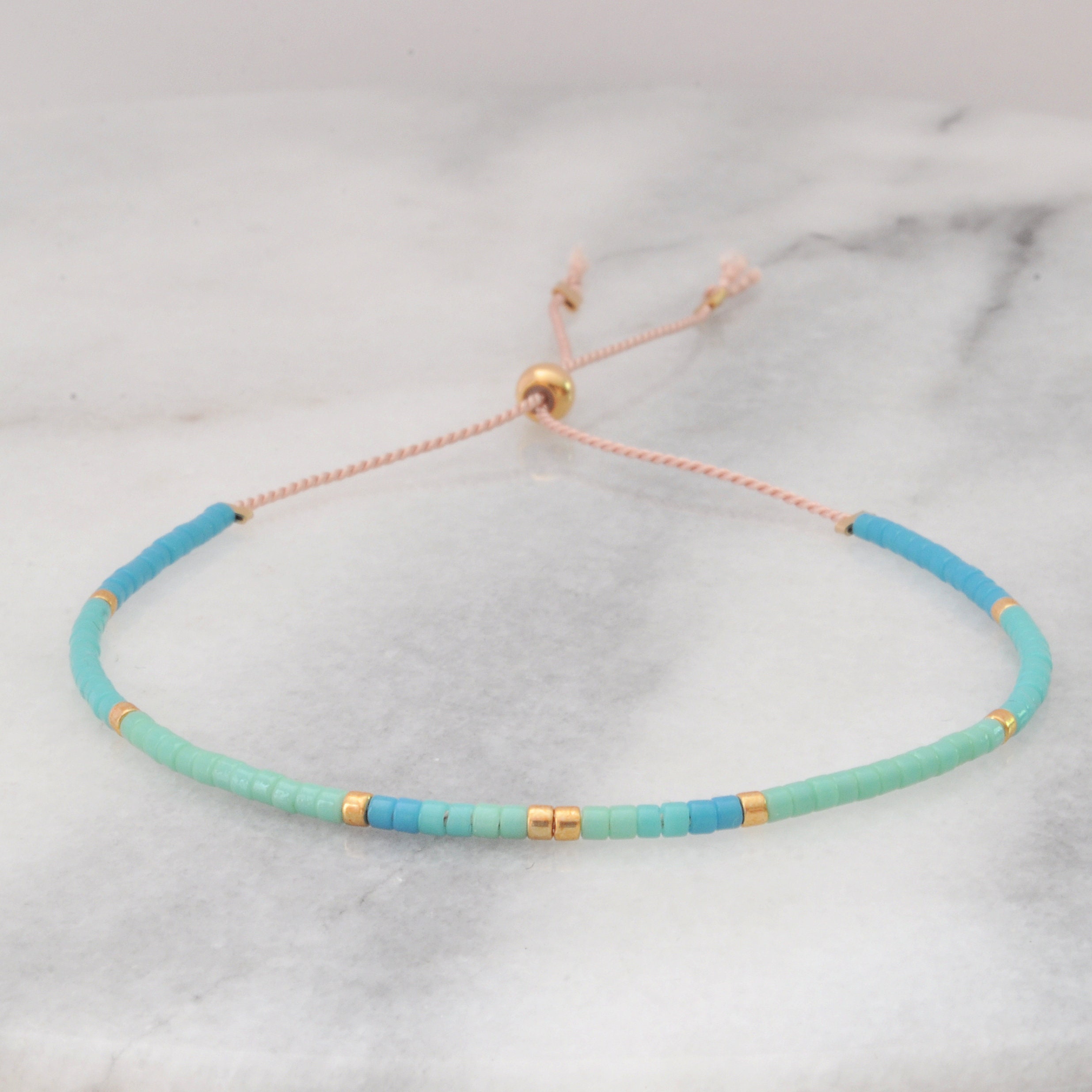 Wewoo - 50m Corde élastique ronde perles Fil Stretch / String / pour Collier  Bracelet Fabrication de bijoux (blanc) - Perles - Rue du Commerce