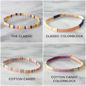 May include: Four colorful beaded bracelets with different color combinations. The bracelets are called "The Classic", "Classic Colorblock", "Cotton Candy", and "Cotton Candy Colorblock".