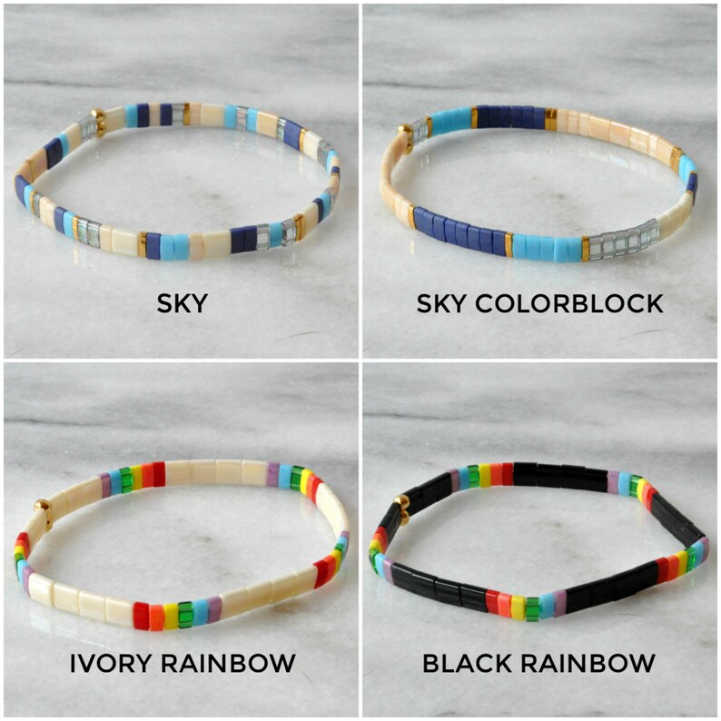 May include: Four different styles of beaded bracelets. The bracelets are made with small, square beads in various colors, including blue, white, ivory, black, red, orange, yellow, green, and purple. The bracelets are arranged in a grid pattern, with each bracelet labeled with its name: "SKY", "SKY COLORBLOCK", "IVORY RAINBOW", and "BLACK RAINBOW".