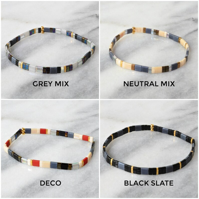 May include: Four different styles of tile bracelets, each with a different color scheme. The bracelets are made of small, square tiles with gold accents. The bracelets are arranged in a grid pattern, with each bracelet labeled with its name: Grey Mix, Neutral Mix, Deco, and Black Slate.