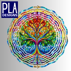 May include: A colorful stained glass mosaic design of a tree with a circular frame. The tree has a rainbow-colored trunk and branches with green leaves and colorful flowers. The frame is made of concentric circles of stained glass in various colors.