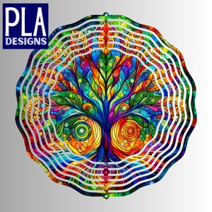 May include: A colorful stained glass tree design with concentric circles around it. The tree is made up of many different colors, including red, orange, yellow, green, blue, and purple. The circles are white and create a layered effect.