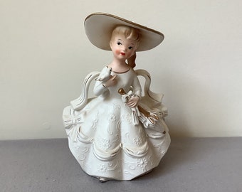 Vintage Rubens Lady Planter 474M white dress, hat and bow with gold trim holding bird