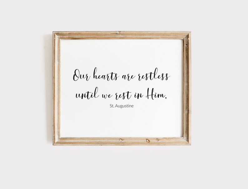 May include: A framed print with a quote by St. Augustine: "Our hearts are restless until we rest in Him."