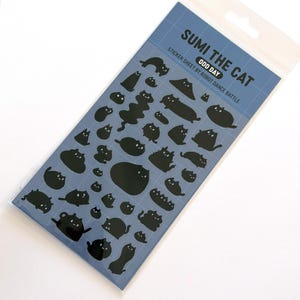 May include: A sticker sheet featuring various black cat silhouettes on a blue background. The text "SUMI THE CAT" and "ODD DAY" are printed at the top. The sticker sheet is in a clear plastic package.
