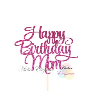May include: Pink glitter cake topper with the text "Happy Birthday Mom".