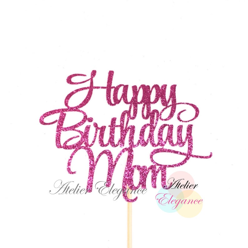 May include: Pink glitter cake topper with the text "Happy Birthday Mom".