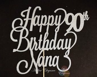 May include: Silver glitter cake topper with the text "Happy 90th Birthday Nana".